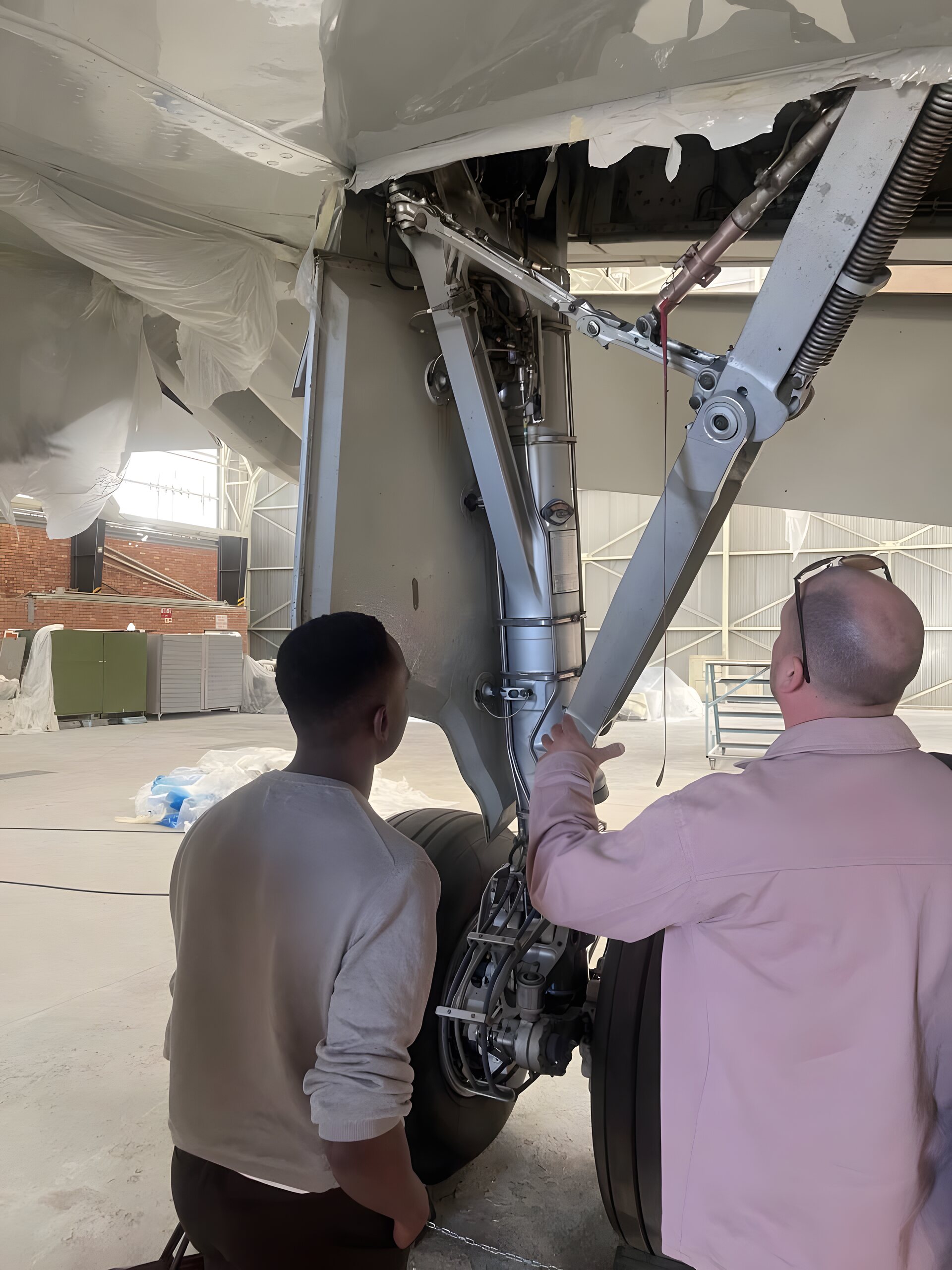 Walking beneath aircraft engine nacelle during inspection